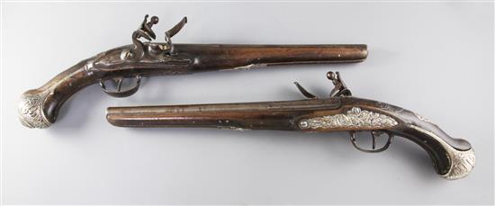 A pair of Turkish silver mounted mahogany flintlock pistols, circa 1800, 48cm.